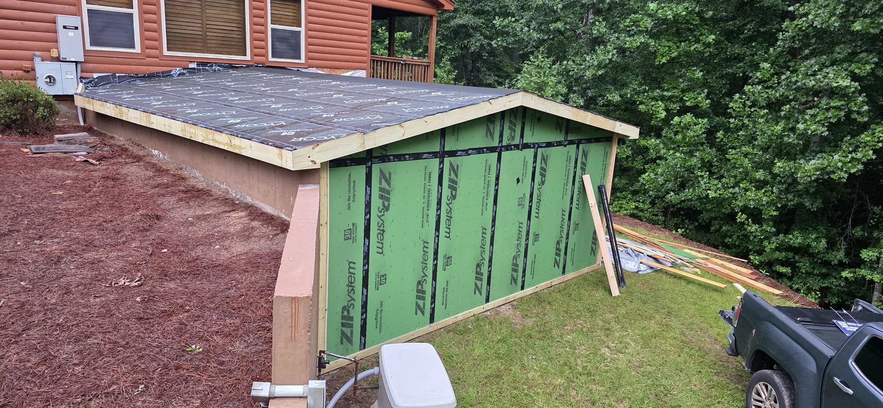 Roofing underlayment installed before the red metal roof