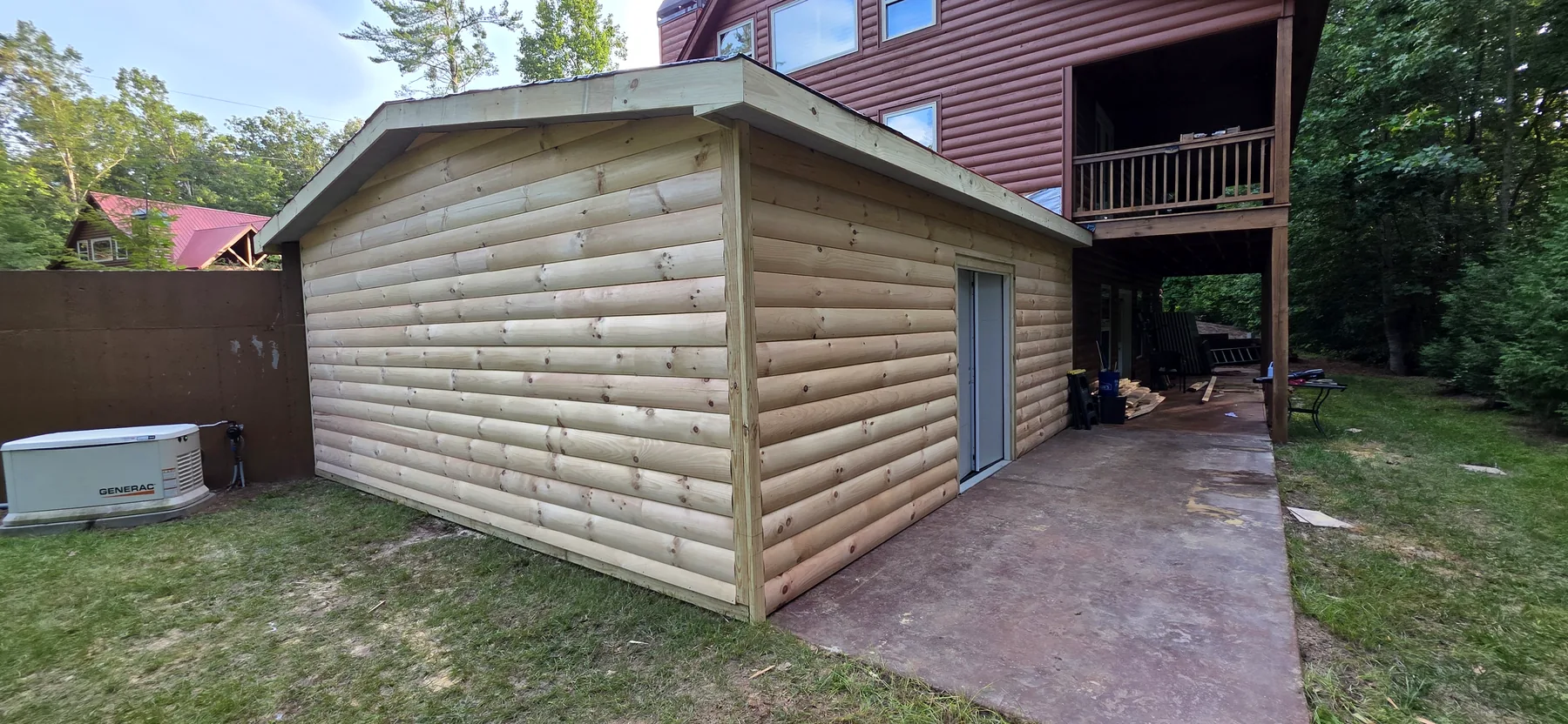 D-log siding installed on the attached storage addition to match the house